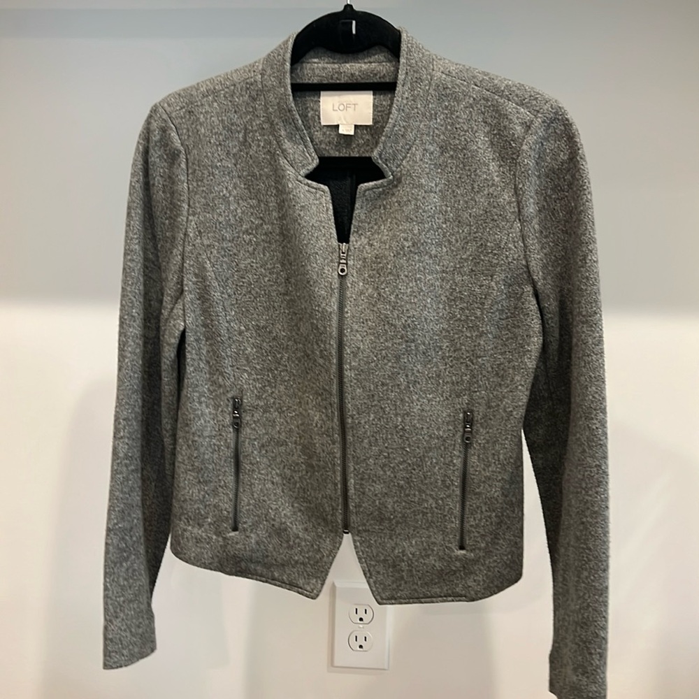 LOFT bolero style jacket with zipper front and zip pockets. 69% cotton 31% poly